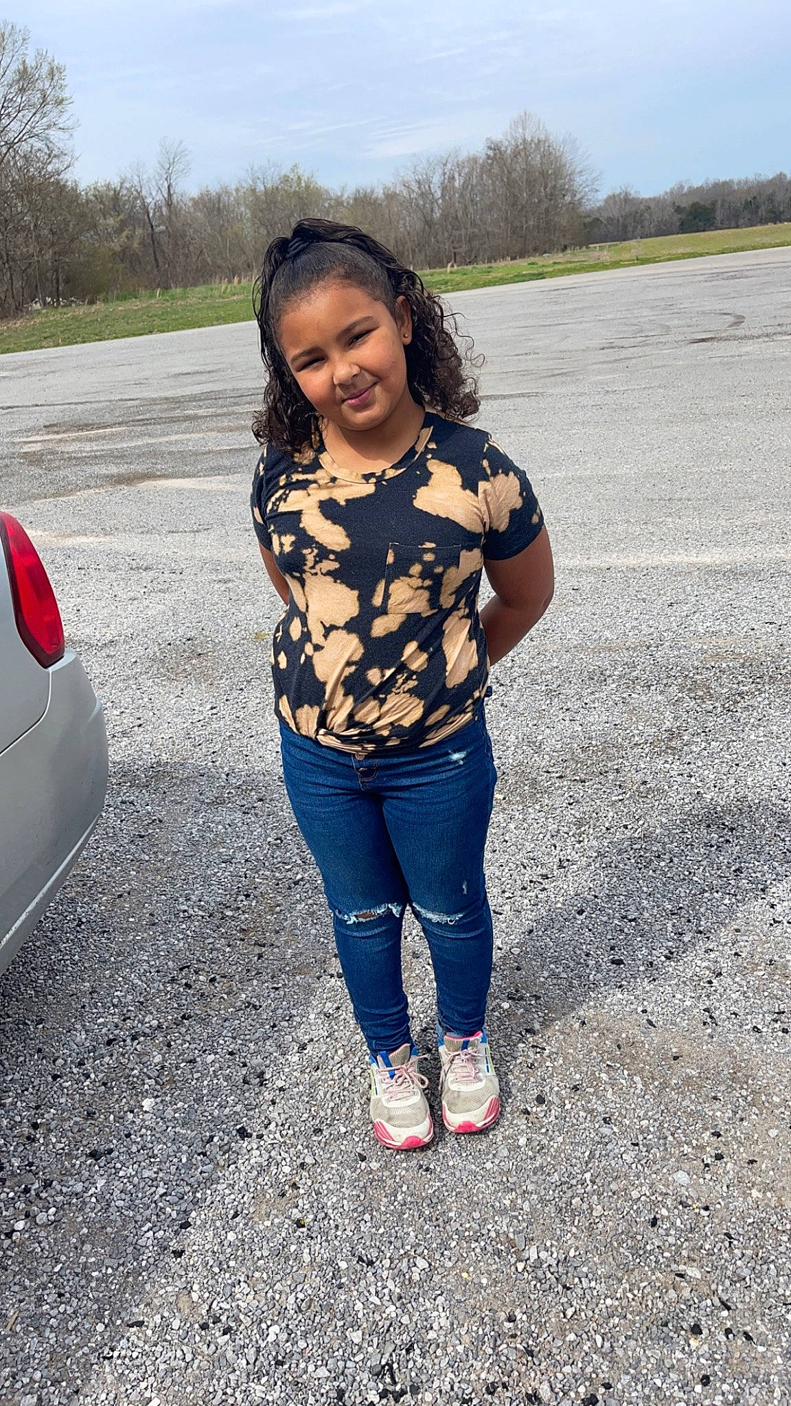 Mia Malone joined the competition — help win amazing prizes! asphalt, automotive_exterior, automotive_lighting, automotive_tire, bumper, car, electric_blue, eye, grass, happy, head, jeans, joy, leisure, motor_vehicle, person, smile, t_shirt, tints_and_shades, tree