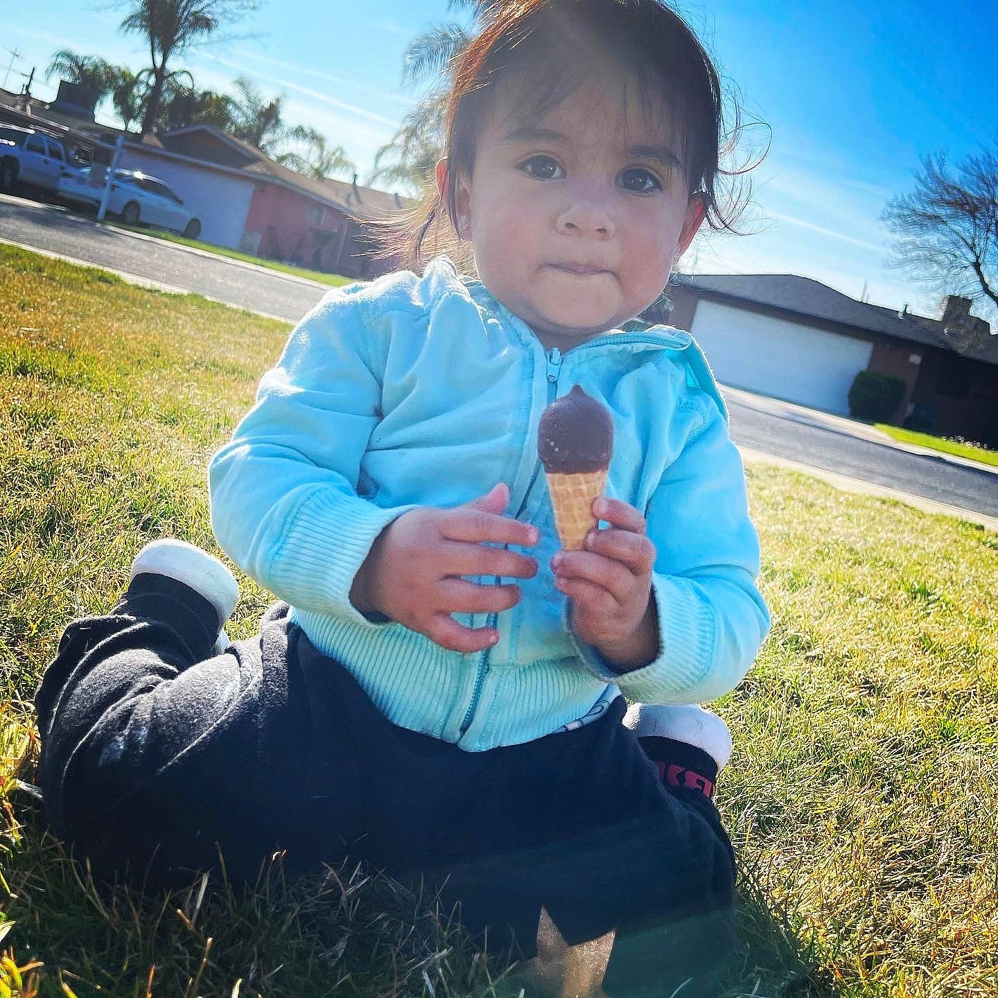 Kehmani is registered to the contest to win money with this photo: baby_toddler_clothing, cloud, cool, grass, hand, happy, head, human_body, leaf, leisure, mountainous_landforms, outerwear, people_in_nature, person, plant, sky, sleeve, sneakers, sunlight, toddler