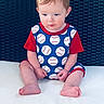 Waylon is registered to the contest to win money with this photo: baby, barefoot, baseball, baseball_pattern, blond_hair, blue_clothing, blue_eyes, chair, child, closeup, indoor, infant, photography, portrait, red_shirt, serious_expression, sitting, sportswear, white_surface, woven_texture
