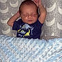 Harrison is registered to the contest to win money with this photo: arms_up, baby, blanket, blue_blanket, child, clothing, cozy, cute, dinosaur_onesie, face, indoors, infant, newborn, patterned_background, peaceful, portrait, resting, sleeping, soft_texture, toddler