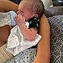 Harrison joined the competition — help win amazing prizes! baby, bottle, feeding, infant, arm, blanket, clothing, couch, cute, face, hand, human, infant_clothing, newborn, person, pillow, resting, sitting, toddler, white_cloth
