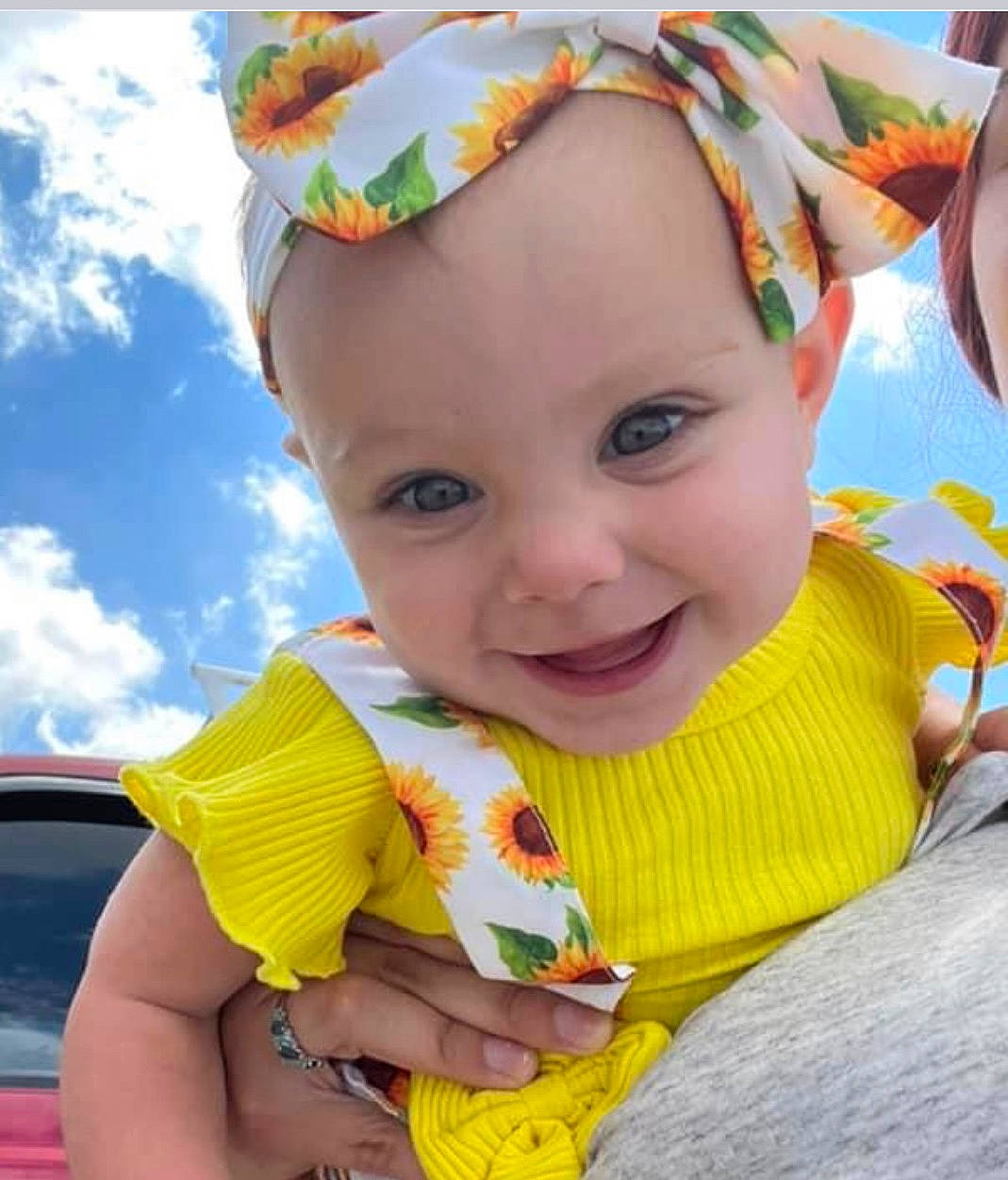 Alena is registered to the contest to win money with this photo: baby_toddler_clothing, cool, dress, eye, facial_expression, finger, grass, hand, happy, headwear, iris, joy, leisure, lip, neck, people_in_nature, person, plant, skin, smile