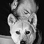 man, dog, hug, black_and_white, portrait, close_up, affection, companion, pet, animal, face, ears, fur, human, love, bond, emotional, chain_bracelet, gentle, tender