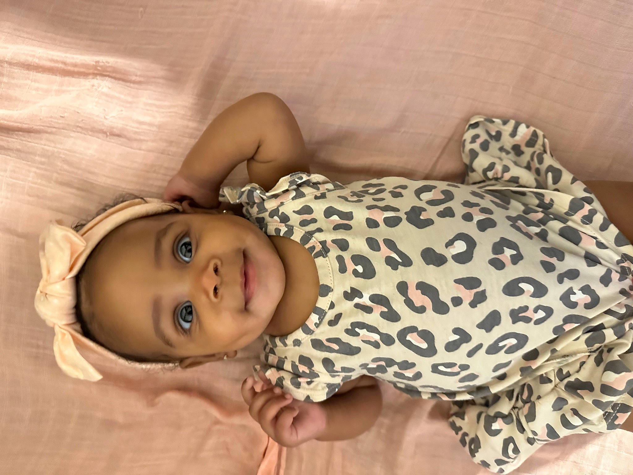 Trinity is registered to the contest to win money with this photo: baby, baby_toddler_clothing, cheek, child, comfort, eye, face, flooring, happy, head, human_body, linens, nose, pattern, person, skin, sleeve, smile, toddler, tree