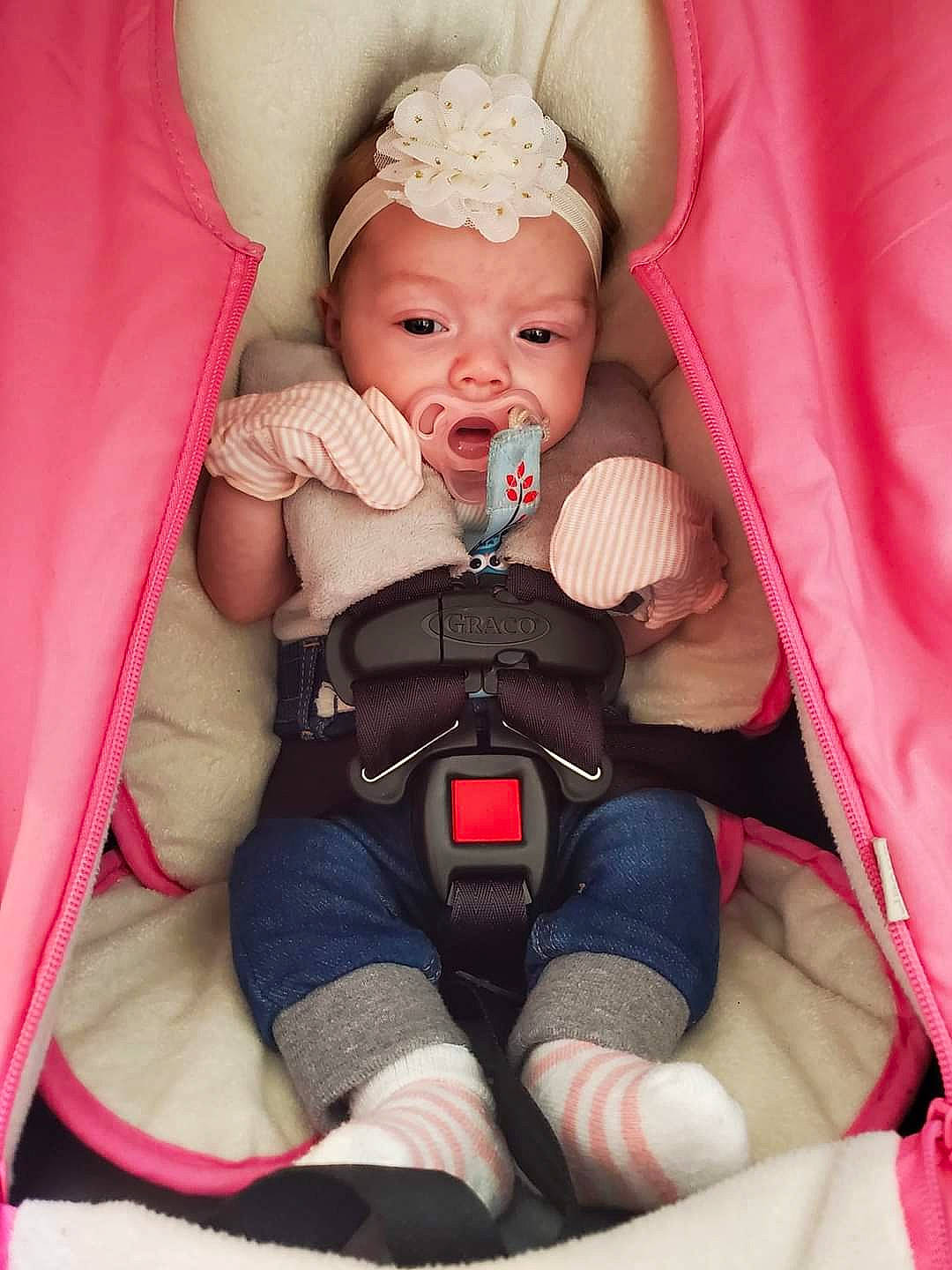 Dixie is registered to the contest to win money with this photo: baby, baby_carriage, baby_toddler_clothing, chair, child, comfort, eyelash, finger, happy, headwear, joint, knee, leg, magenta, mouth, nail, person, pink, product, thigh