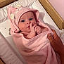 Ava is registered to the contest to win money with this photo: baby, infant, pink_towel, hooded_towel, blue_eyes, hand, crib, wooden_crib, star_pattern, bedding, wrapped, cute, newborn, child, person, indoor, soft_texture, towel, skin, gaze