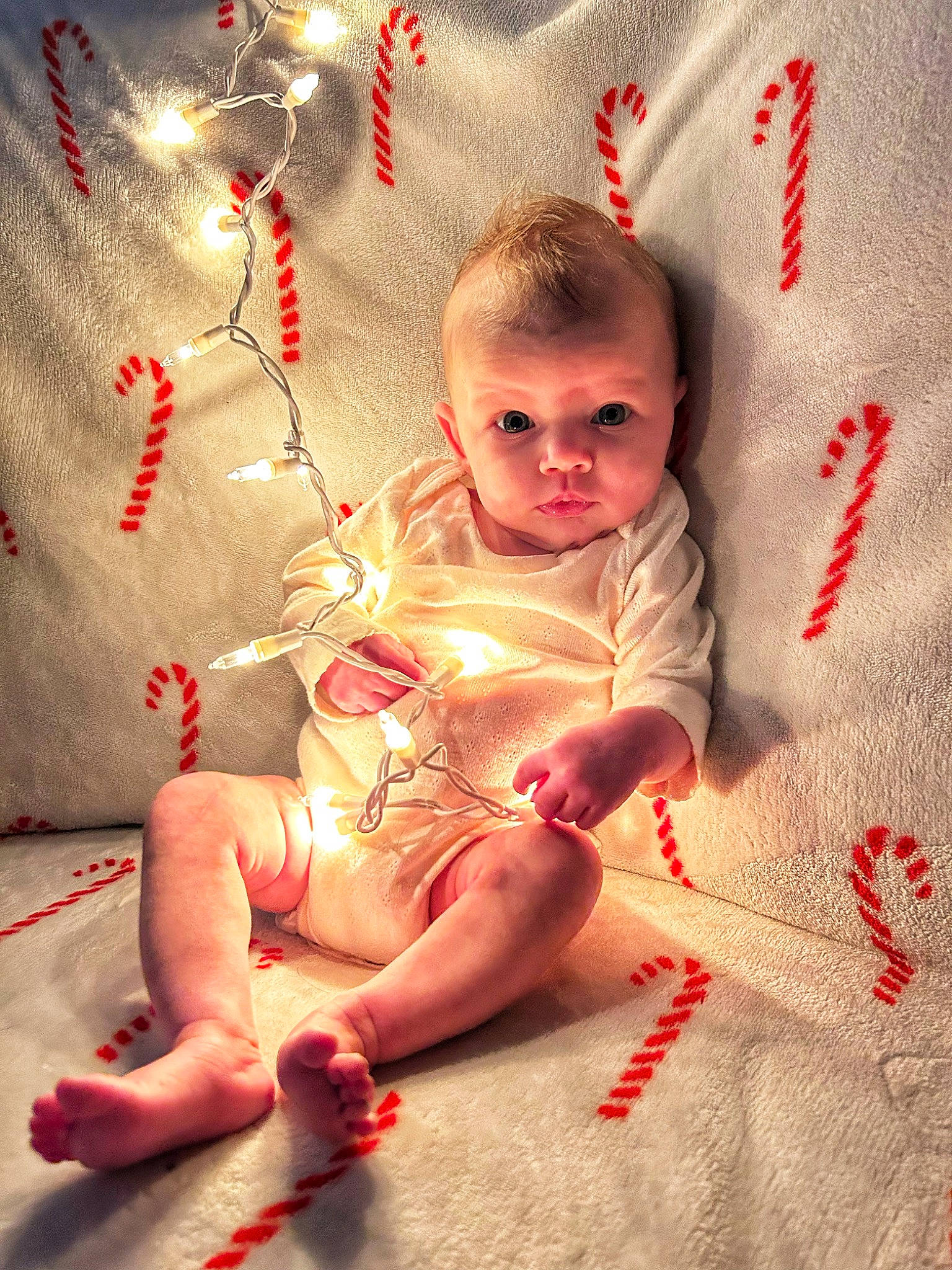 Kinslee joined the competition — help win amazing prizes! baby, baby_toddler_clothing, child, christmas_ornament, comfort, event, eye, facial_expression, foot, happy, head, holiday, human_body, human_leg, lap, mammal, person, pink, room, skin