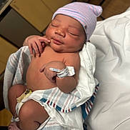 Errol joined the competition — help win amazing prizes! newborn, baby, infant, hospital, blanket, hat, sleeping, face, hand, wristband, skin, person, hospitalroom, medical, cute, peaceful, wrapped, lying, resting, tiny