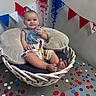 Winter joined the competition — help win amazing prizes! baby, child, smiling, wicker_chair, cushion, confetti, celebration, indoor, festive, colorful, happy, face, foot, clothing, blue, red, white, decorations, portrait, person