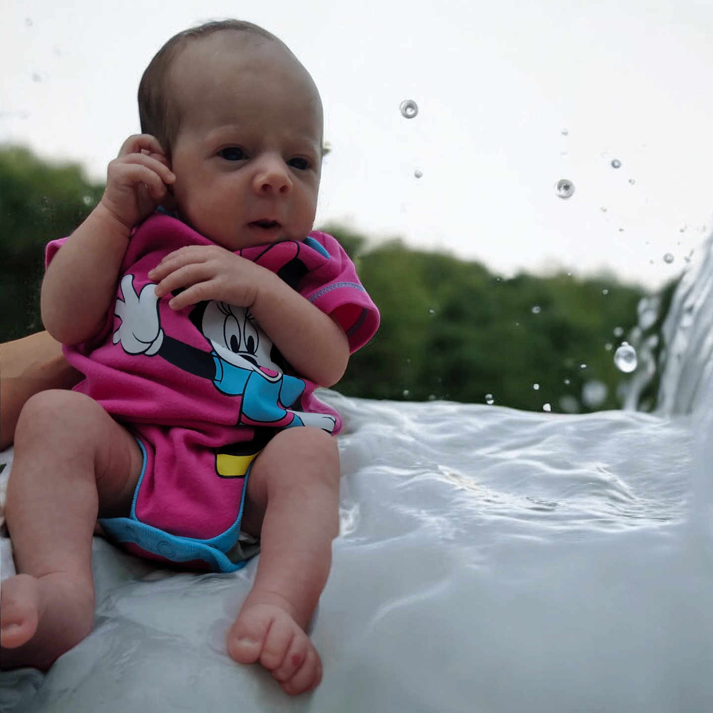 Addison joined the competition — help win amazing prizes! baby, bodypart, clothing, face, finger, hand, happy, head, lifejacket, newborn, outdoors, person, photography, portrait, sitting, smile, t_shirt, toy, vest, water