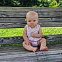 baby, bench, outdoor, grass, tree, sky, flower, wood, child, sitting, nature, summer, cute, infant, portrait, greenery, daylight, casual, serious, park