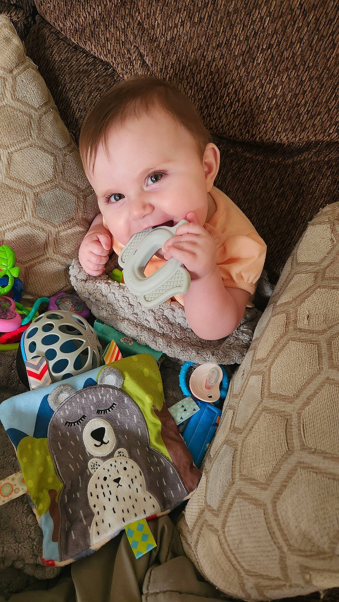 Leona is registered to the contest to win money with this photo: baby, baby_products, baby_toddler_clothing, baby_toys, cheek, child, comfort, grass, happy, head, iris, linens, pattern, person, play, sitting, sleeve, sock, textile, toddler