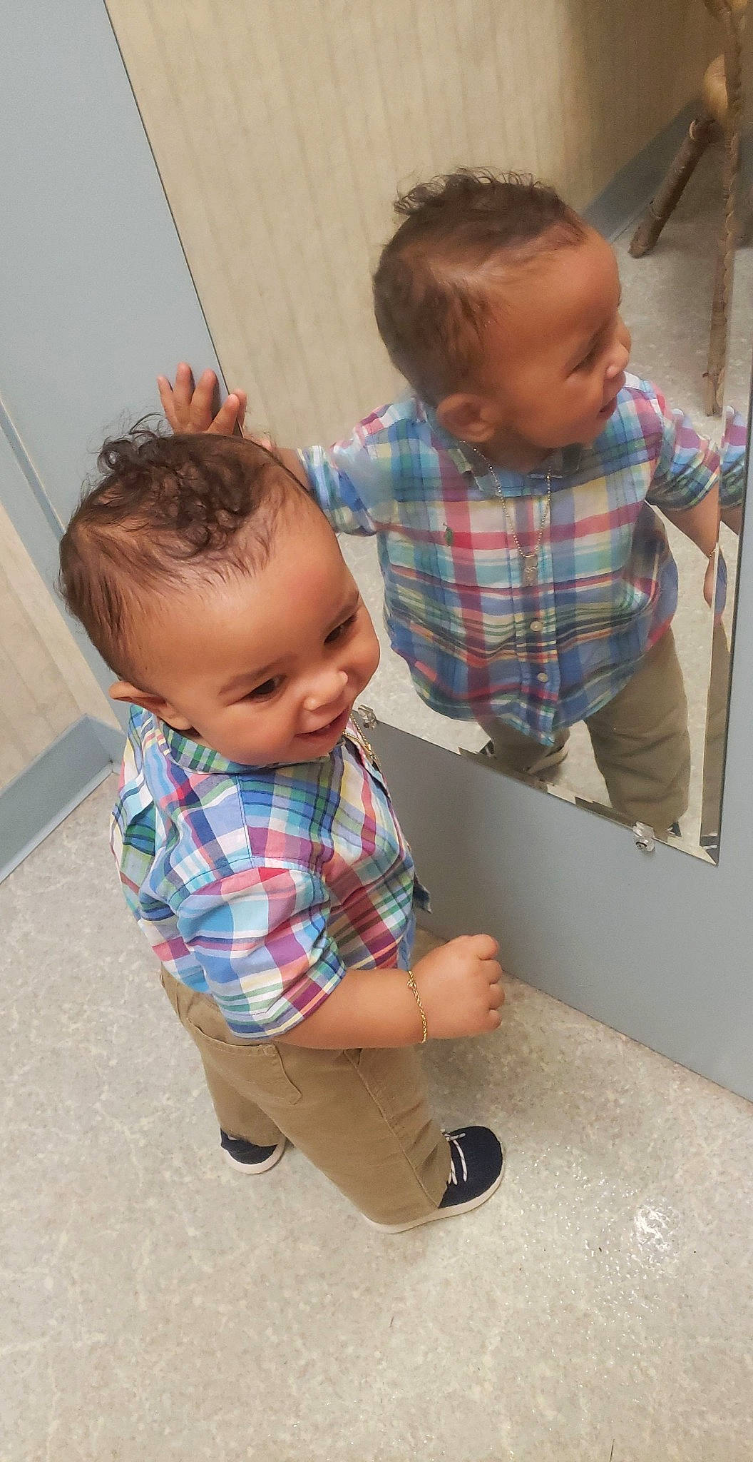 Kartier is registered to the contest to win money with this photo: arm, baby, baby_toddler_clothing, cheek, child, ear, floor, flooring, head, leg, pattern, person, plaid, play, product, room, skin, smile, standing, toddler