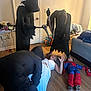 Kristopher joined the competition — help win amazing prizes! indoor, people, costumes, black_clothing, woman, child, spiderman_costume, floor, wooden_floor, door, bed, table, toys, fun, playful, party, halloween, pretend, smile, family