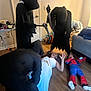 Nicholas joined the competition — help win amazing prizes! indoor, child, costume, spiderman, hooded_cloak, play, floor, dress, toy_weapon, fun, family, person, wooden_floor, room, door, furniture, couch, light, shadow, game