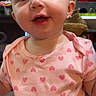 Lilly joined the competition — help win amazing prizes! baby, child, infant, pink_shirt, heart_pattern, smiling, face, eyes, mouth, indoor, carpet, toy, person, cute, adorable, young, happy, clothing, head, skin