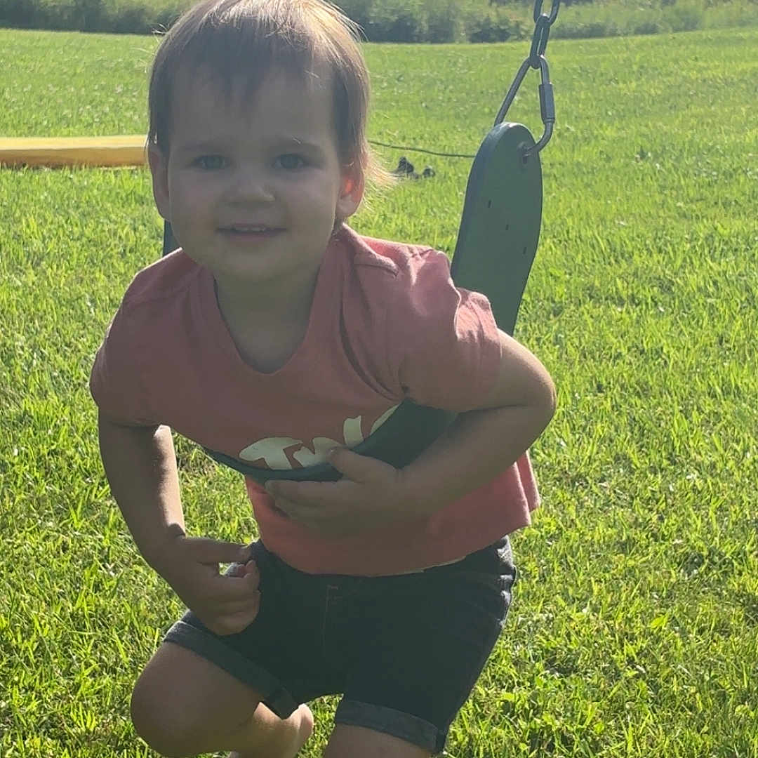 Lanie is registered to the contest to win money with this photo: barefoot, child, clouds, daytime, fun, grass, greenery, happy, nature, outdoor, play, playground, shorts, sky, smile, summer, sunlight, swing, toddler, tshirt