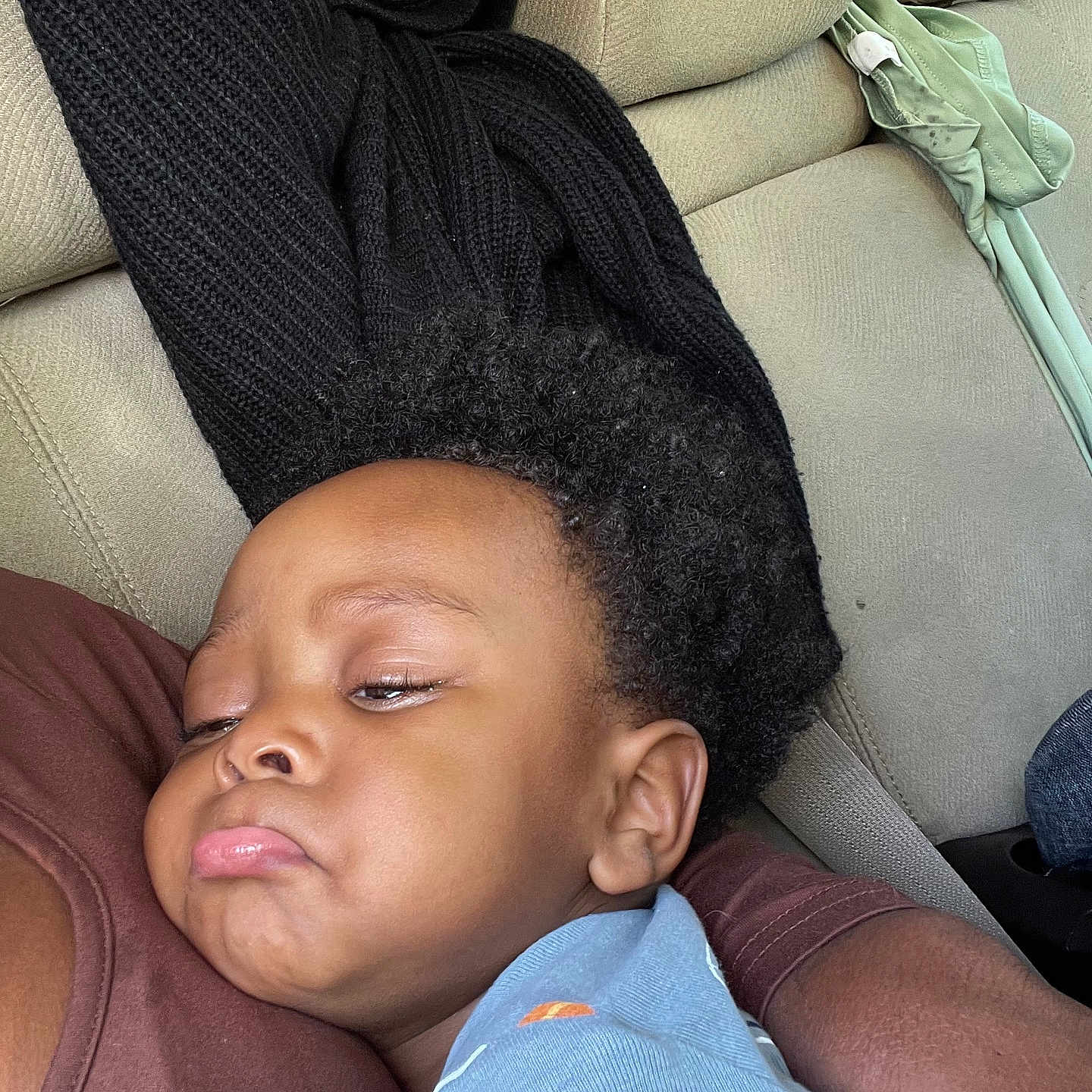 Zamell joined the competition — help win amazing prizes! adult_arm, black_sweater, blue_shirt, car_interior, child, closeup, clothing, comfort, cuddle, curly_hair, patterned_shirt, person, portrait, pout, relax, rest, seat, seatbelt, sleepy, toddler