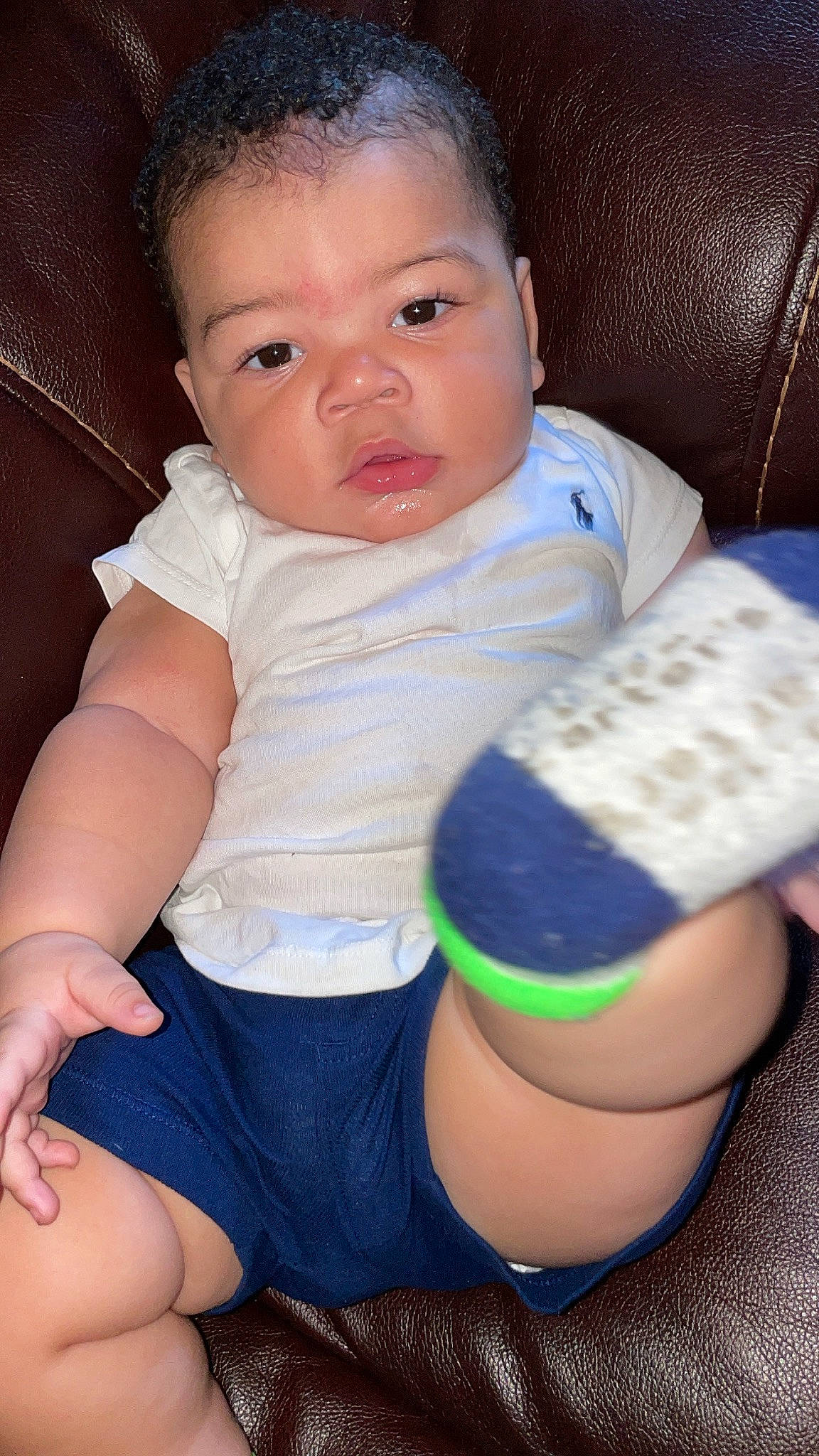 Christian joined the competition — help win amazing prizes! arm, azure, baby, baby_toddler_clothing, blue, cheek, child, comfort, eye, face, finger, hairstyle, iris, knee, leg, person, plastic_bottle, skin, sleeve, thigh
