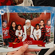 Ivey Codova joined the competition — help win amazing prizes! family, child, santa_claus, christmas, holiday, portrait, smile, woman, man, girl, festive, red_clothing, glasses, plaid, beard, wreath, indoor, photograph, celebration, winter