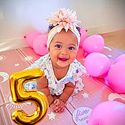 Ari Gianna joined the competition — help win amazing prizes! baby, child, infant, smiling, happy, birthday, number_five, balloons, pink, golden_balloon, flower_headband, floral_dress, portrait, indoor, party, celebration, play_mat, sitting, face, photography