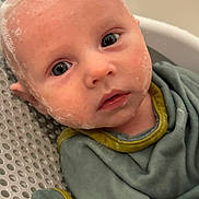 Dominic joined the competition — help win amazing prizes! baby, child, face, soap_bubbles, bath, water, clothing, green_outfit, close_up, skin, expression, head, eyes, infant, cute, portrait, wet, indoor, person, newborn