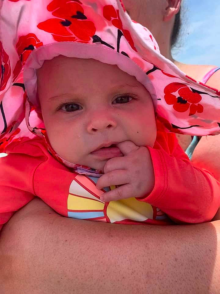 Maddie joined the competition — help win amazing prizes! baby, baby_toddler_clothing, cheek, child, chin, eyebrow, eyelash, fun, gesture, grass, happy, headwear, lip, magenta, mouth, nose, pattern, person, pink, skin