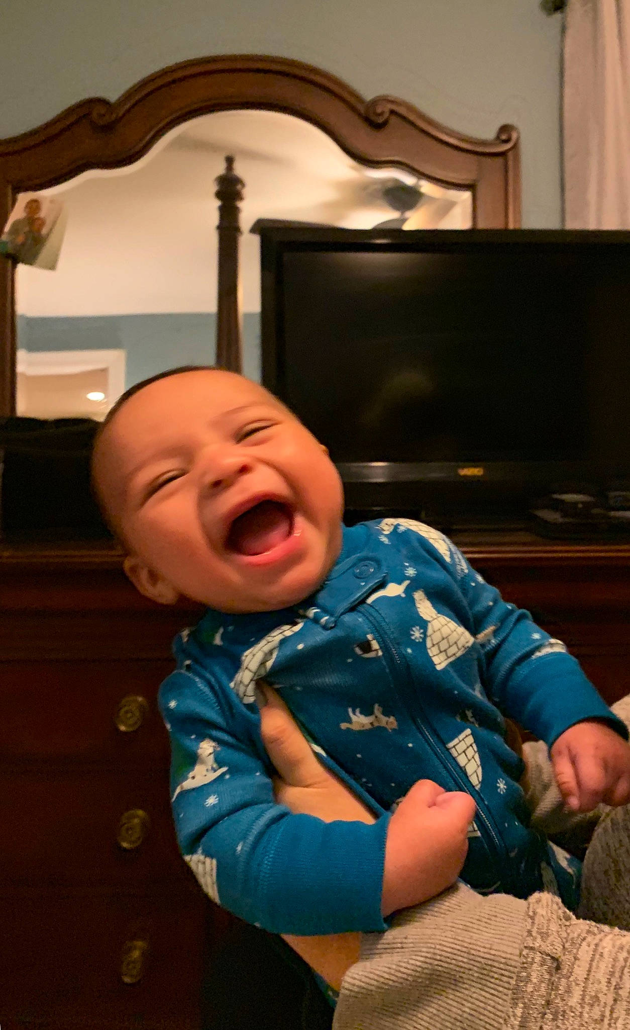 Dash is registered to the contest to win money with this photo: baby, cheek, child, facial_expression, fun, happy, laugh, person, room, sitting, smile, toddler, tongue, tooth, vacation