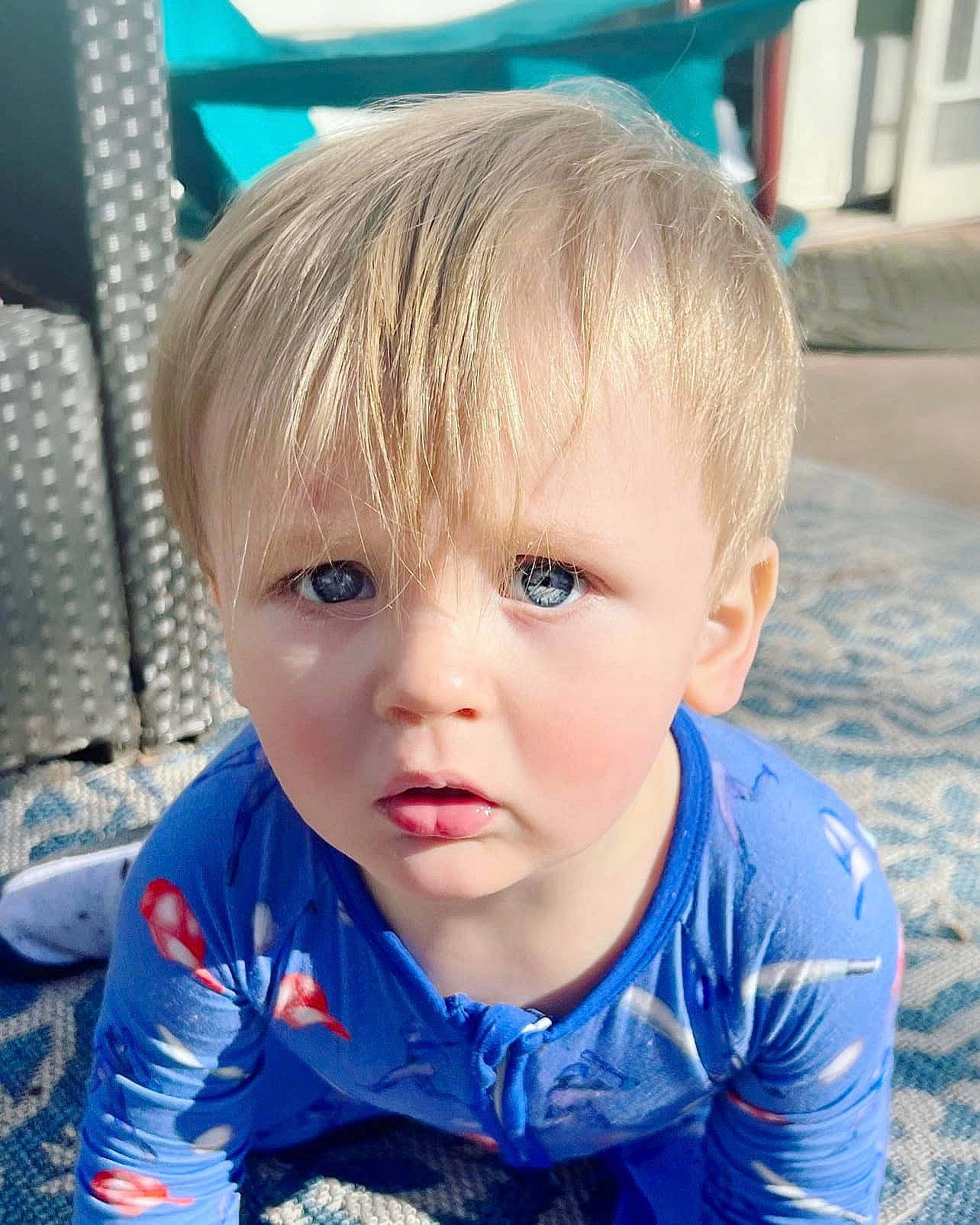 Caiden is registered to the contest to win money with this photo: azure, baby, baby_toddler_clothing, blond, blue, cheek, child, cool, electric_blue, fun, grass, hairstyle, happy, leisure, nose, person, recreation, sitting, skin, sleeve