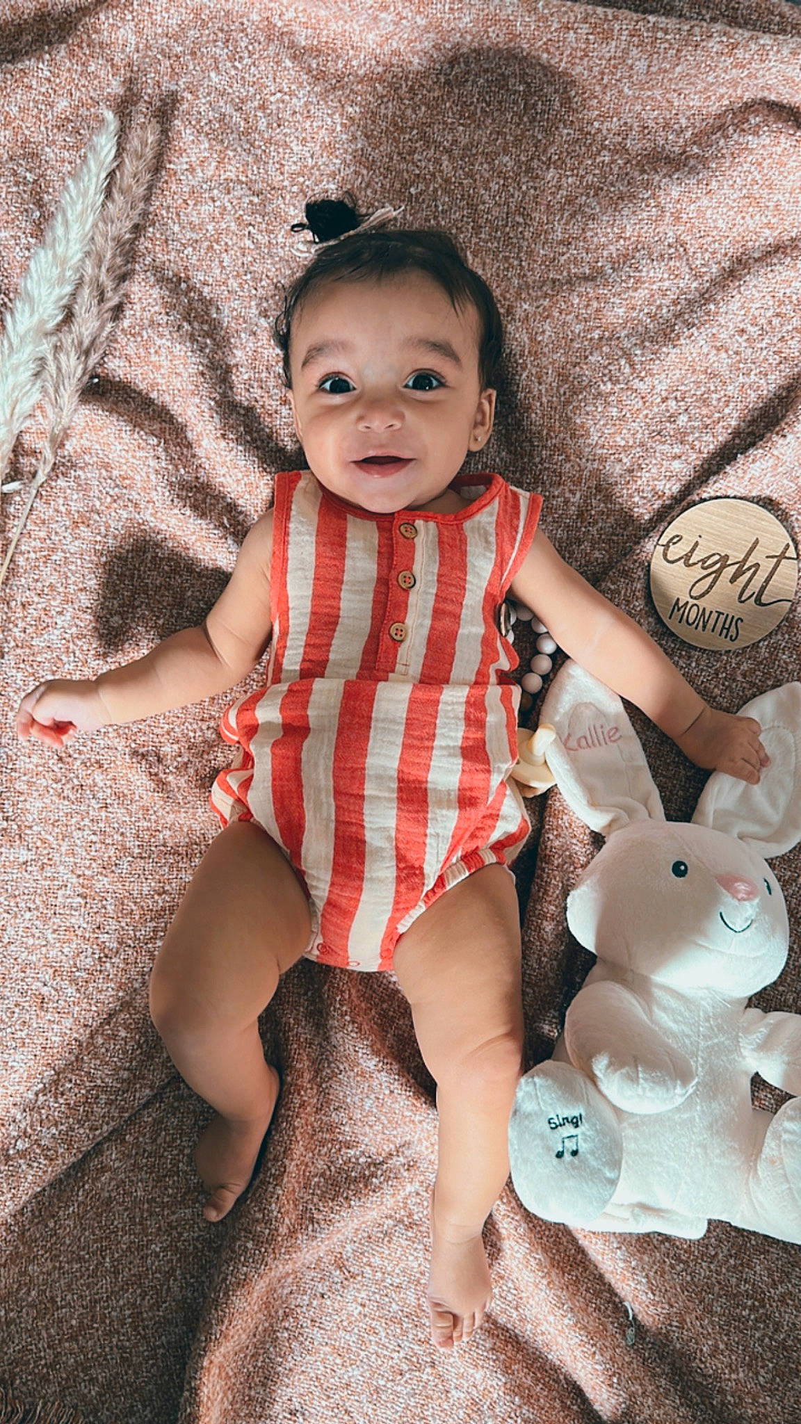 Kallie is registered to the contest to win money with this photo: baby_toddler_clothing, child, dress, eye, face, fawn, flash_photography, hand, happy, lip, pattern, person, pink, skin, sleeve, smile, textile, thigh, toddler, toy