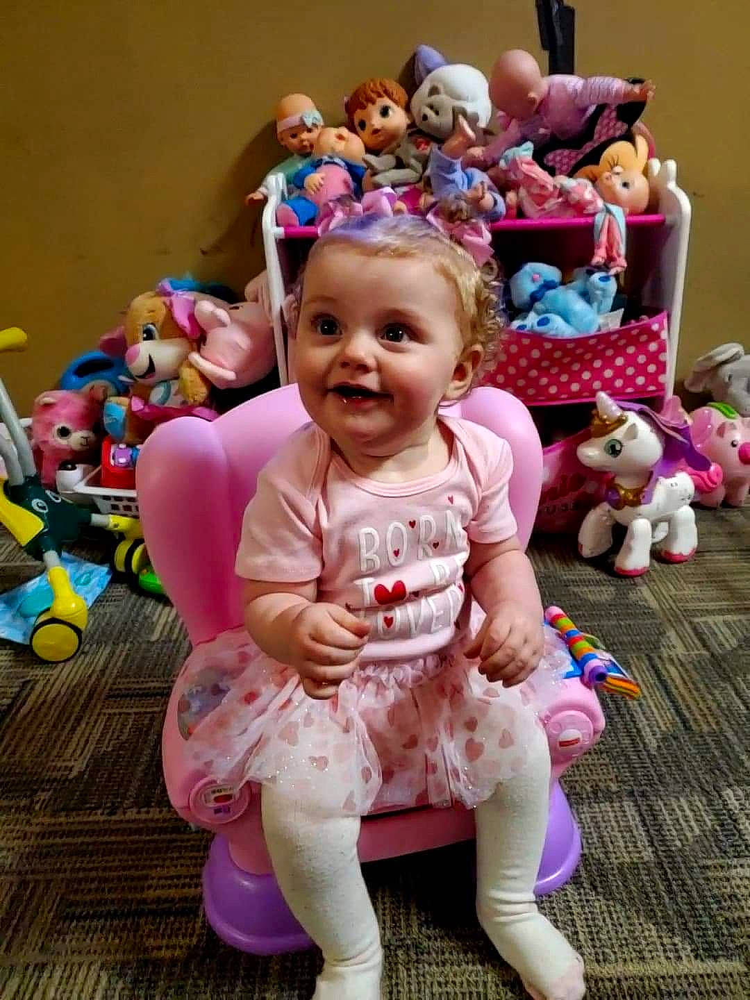 Adalie is registered to the contest to win money with this photo: baby, baby_toddler_clothing, baby_toys, child, costume, event, fun, happy, joy, mammal, person, pink, play, plush, purple, smile, snapshot, stuffed_toy, textile, toddler