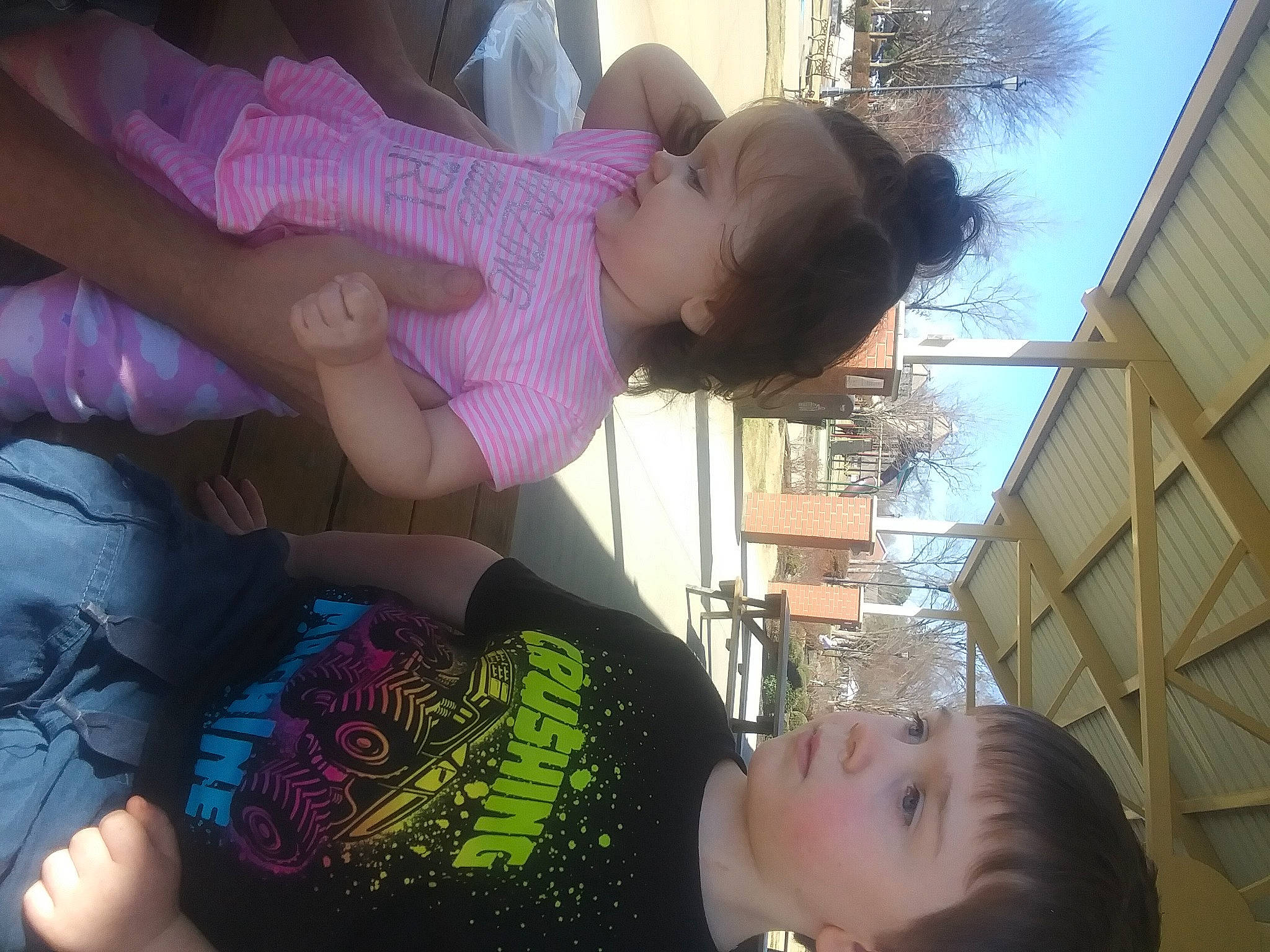 Andrew is registered to the contest to win money with this photo: arm, baby, black, black_hair, cool, face, finger, fun, gesture, happy, light, mouth, organ, person, photograph, plant, sky, summer, toddler, tree