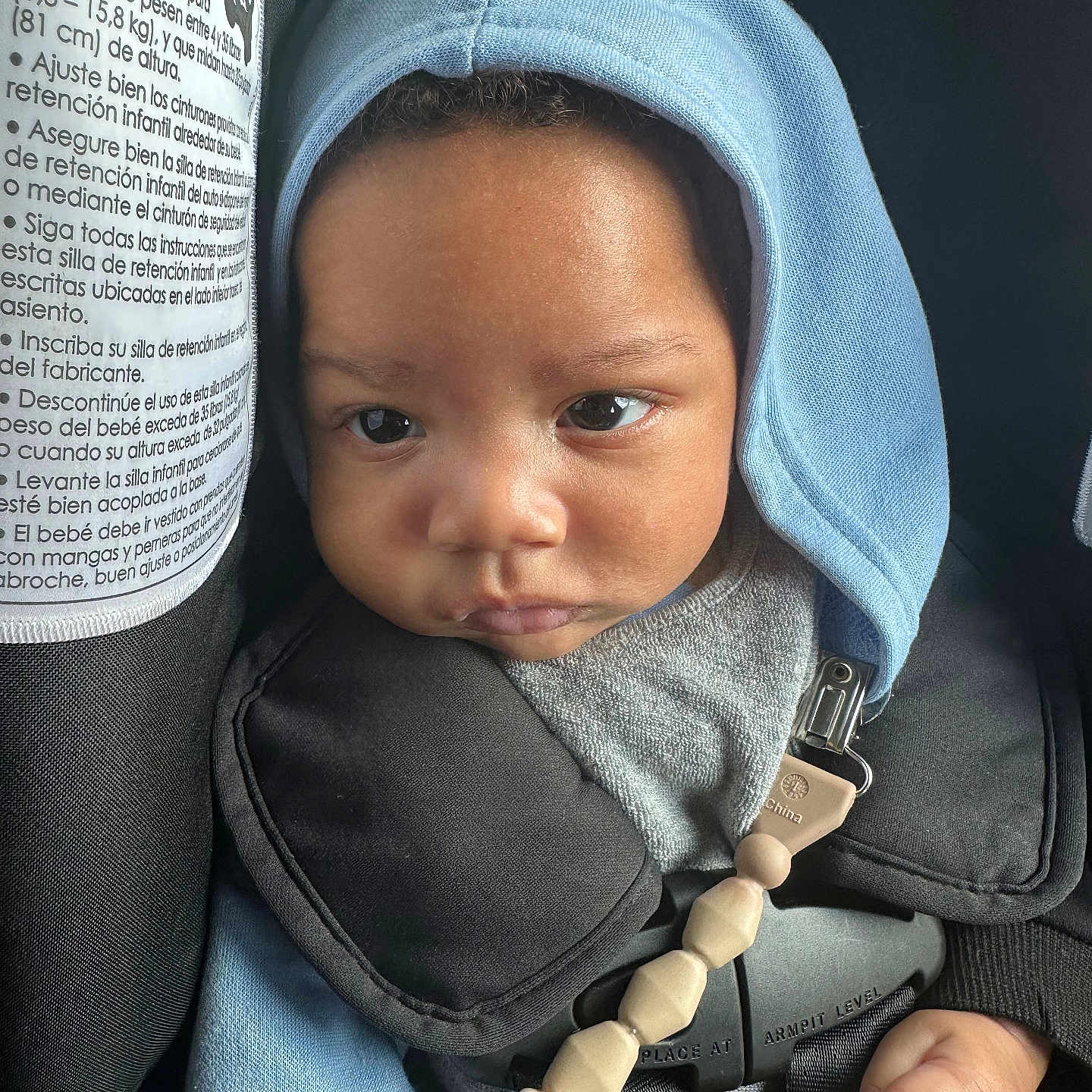 Jaidyn -Andre joined the competition — help win amazing prizes! baby, car_seat, child, closeup, clothing, cute, expression, eyes, face, hand, headwear, hood, indoors, infant, pacifier_clip, safety, seatbelt, skin, straps, young_child