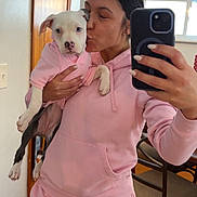 Raya joined the competition — help win amazing prizes! affection, casual, chair, dog, hand, home, hoodie, indoor, kiss, love, mirror, pet, phone, pink_clothing, puppy, selfie, sweatpants, window, woman, wooden_floor