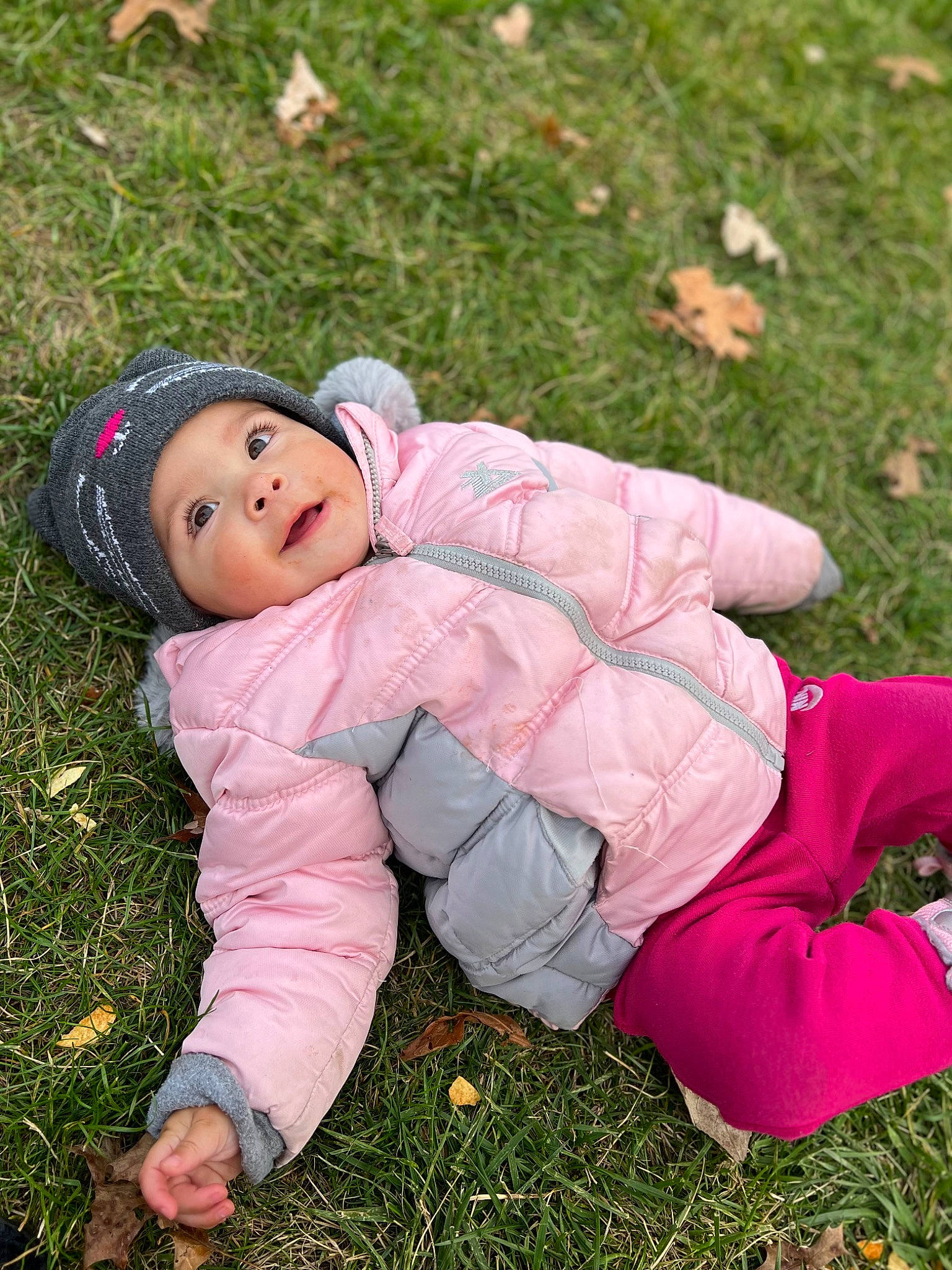 Leila joined the competition — help win amazing prizes! baby, baby_toddler_clothing, child, foot, fun, grass, grass_family, grassland, groundcover, happy, hat, headwear, lawn, pattern, people_in_nature, person, pink, plant, sitting, sleeve