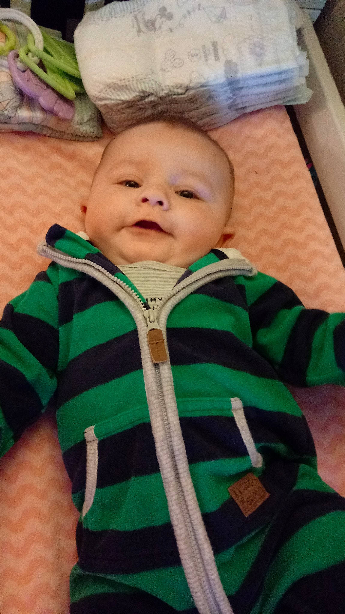 Oliver is registered to the contest to win money with this photo: baby, cheek, child, eye, face, green, head, nose, outerwear, person, skin, smile, toddler