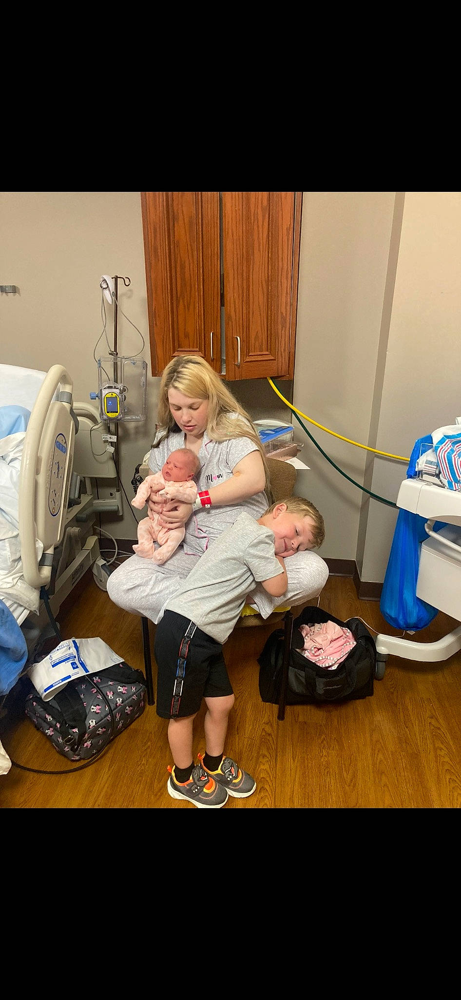 Greyson is registered to the contest to win money with this photo: baby, baby_products, backpack, bag, child, comfort, event, flooring, fun, health_care, hospital, leisure, luggage_and_bags, machine, person, play, room, sandal, service, sitting