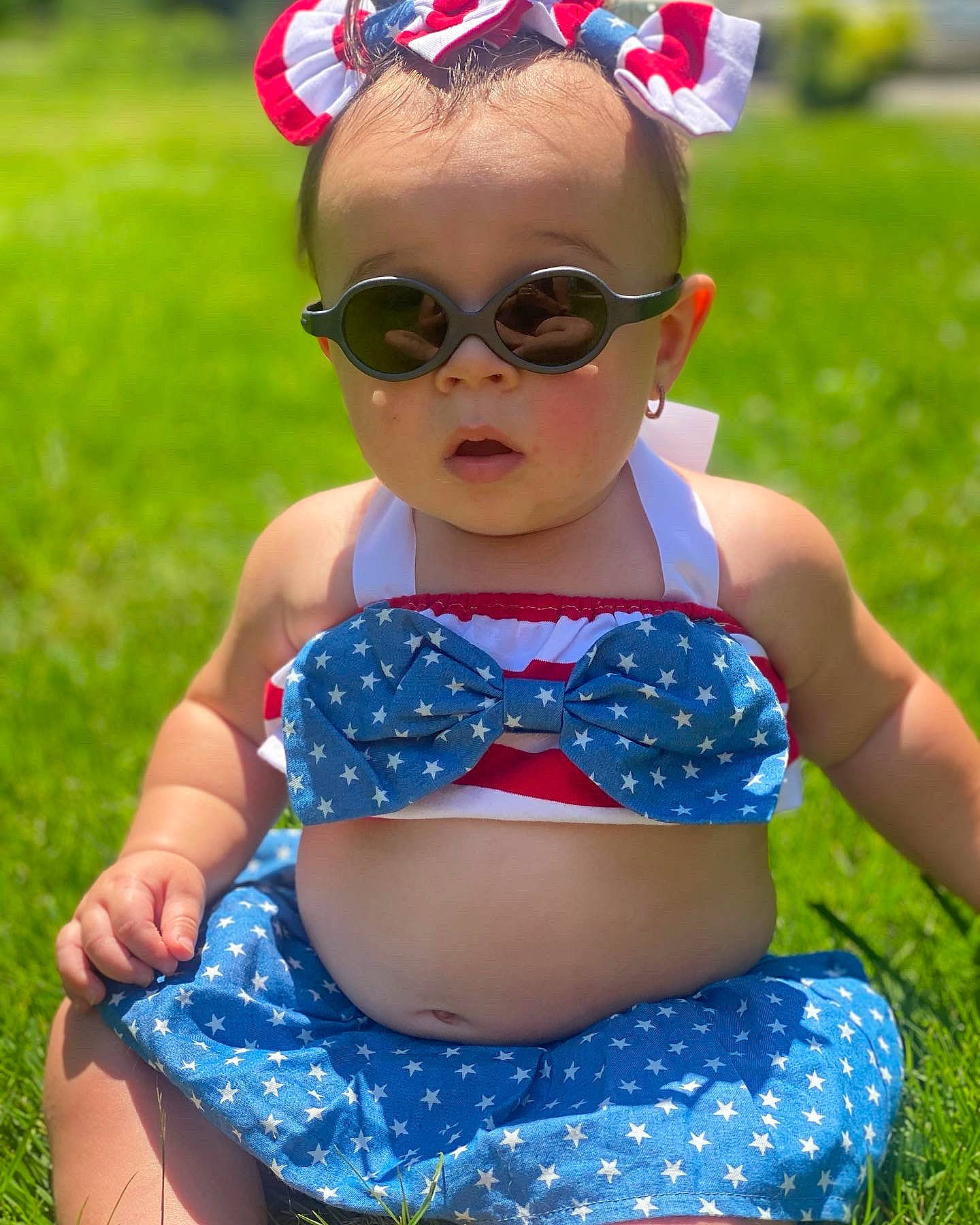 Demi joined the competition — help win amazing prizes! baby_toddler_clothing, blue, eyewear, fashion, glasses, goggles, grass, green, happy, person, photograph, pink, plant, red, summer, sunglasses, thigh, toddler, trunk, vision_care