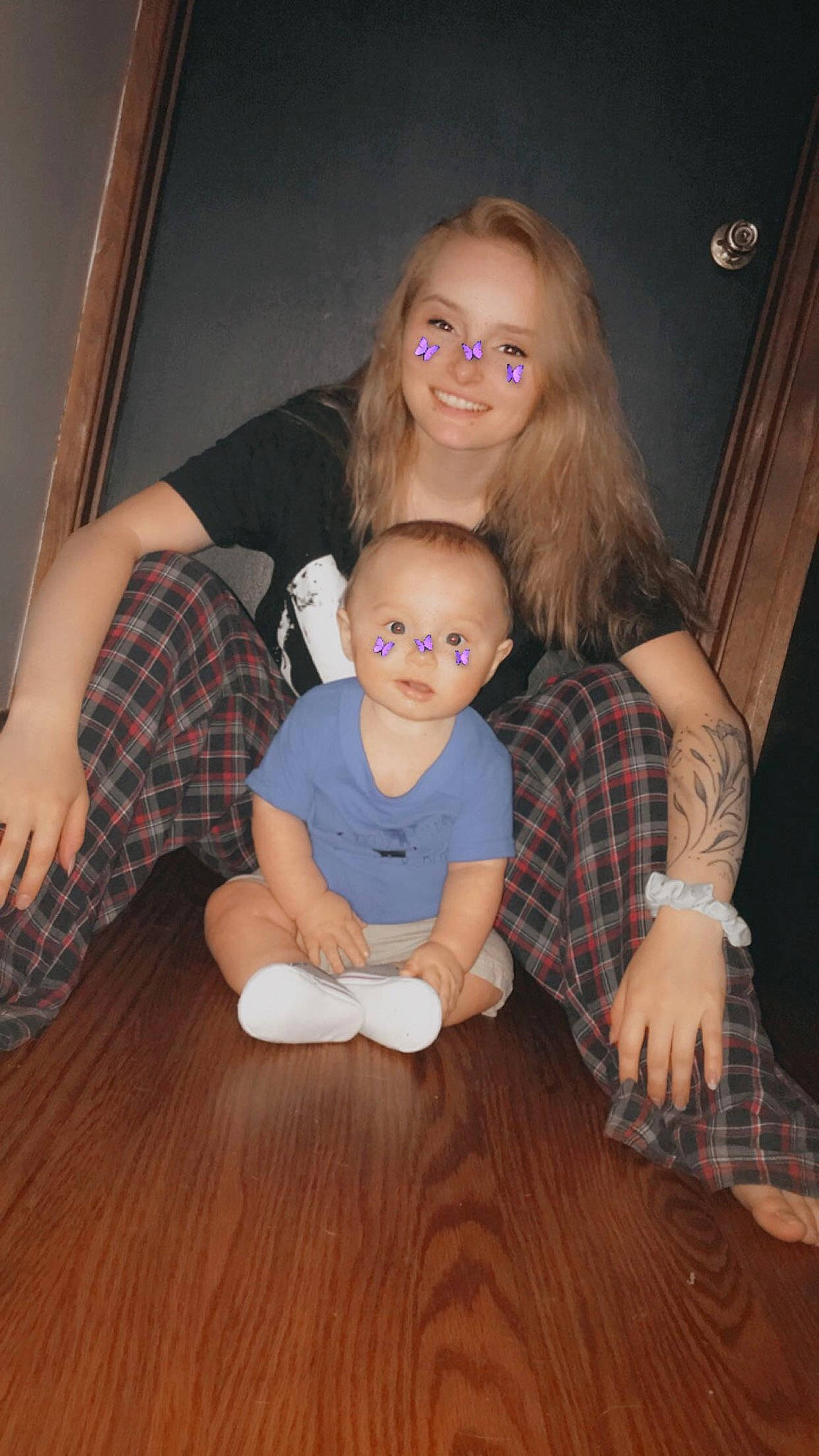 Ryder joined the competition — help win amazing prizes! blond, child, finger, floor, flooring, fun, hardwood, iris, joy, lap, leg, long_hair, person, plaid, sitting, skin, smile, toddler, wood, wood_flooring