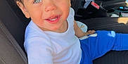 Cohen joined the competition — help win amazing prizes! baby, blue_eyes, blue_pants, car_interior, car_seat, casual_clothing, child, curly_hair, cute, hands, happy, indoor, person, portrait, seat, seatbelt, smiling, sunlight, toddler, white_tshirt