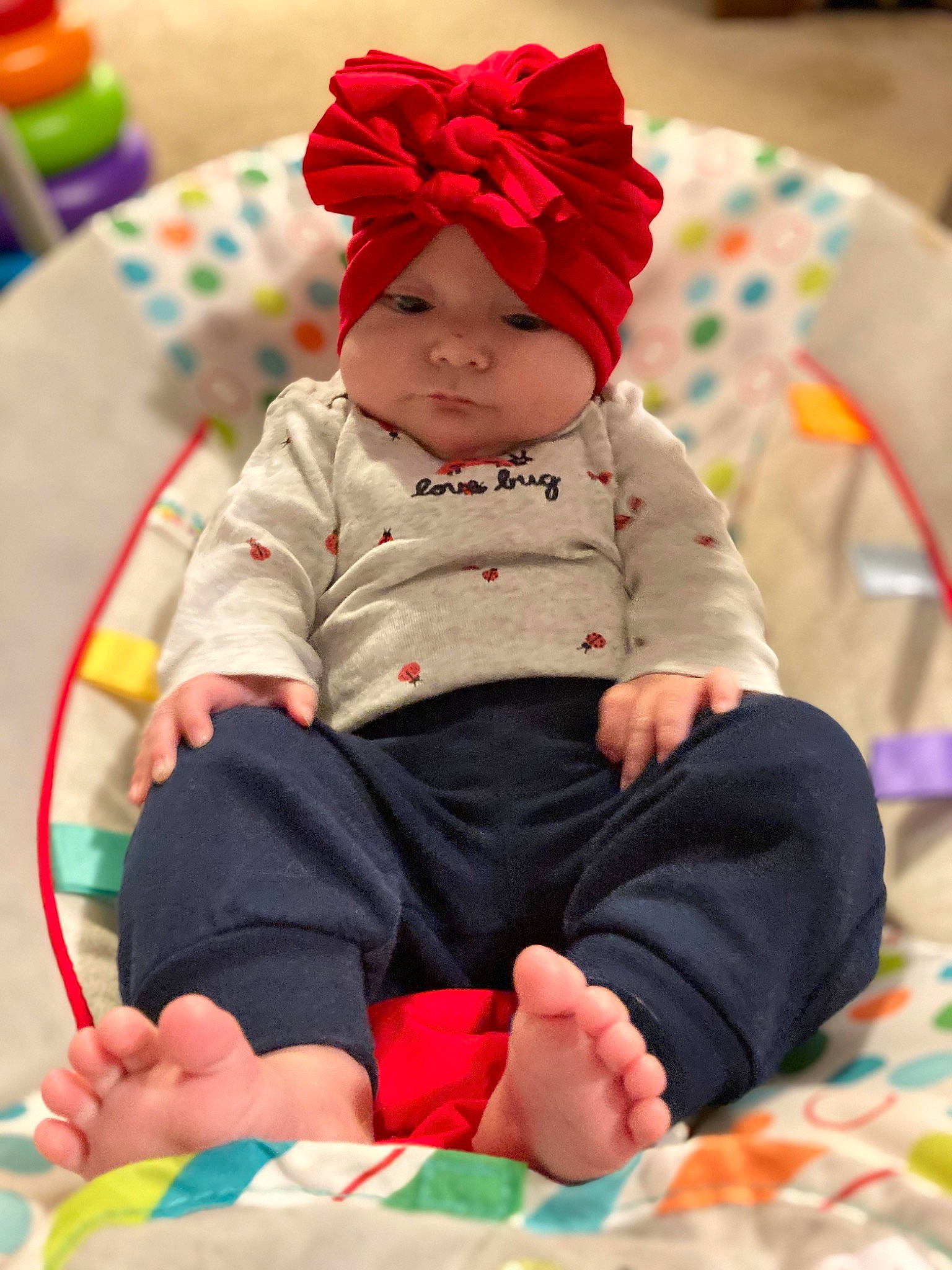 Alaia joined the competition — help win amazing prizes! baby, baby_toddler_clothing, cap, child, comfort, dress, event, fun, happy, headgear, headwear, leisure, magenta, person, red, sitting, skin, sleeve, sock, textile