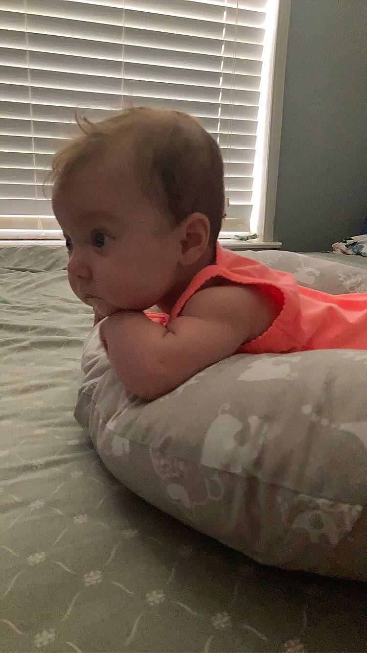 Alaia is registered to the contest to win money with this photo: baby, baby_toddler_clothing, bathing, bedding, chest, child, comfort, crawling, flooring, fun, human_leg, linens, person, room, sitting, toddler, window, window_blind, window_covering