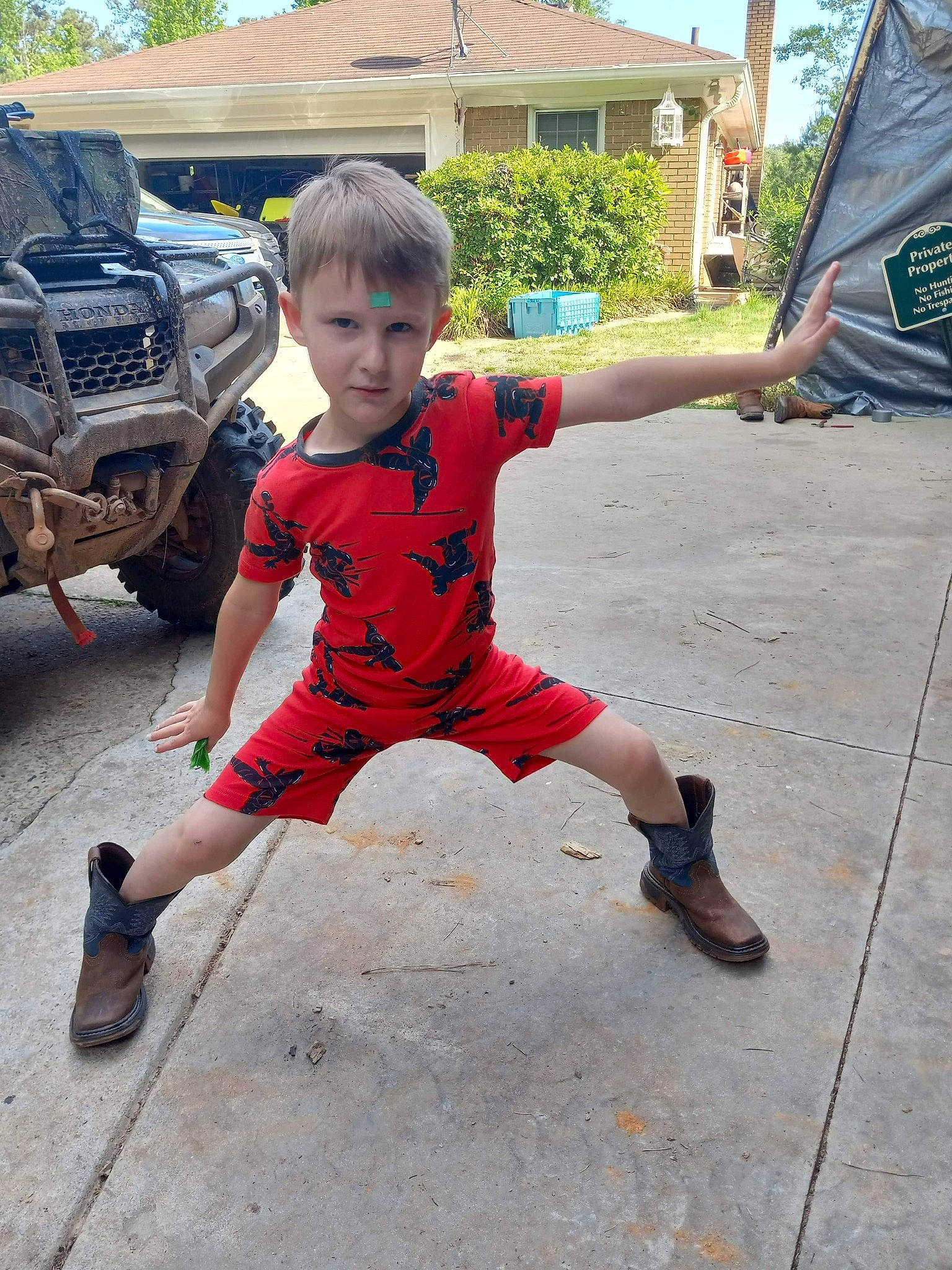 Braxtyn joined the competition — help win amazing prizes! asphalt, bumper, car, concrete, fun, grass, human_leg, leisure, person, public_space, recreation, road_surface, sidewalk, sky, sneakers, soil, t_shirt, toddler, tree, vehicle_door