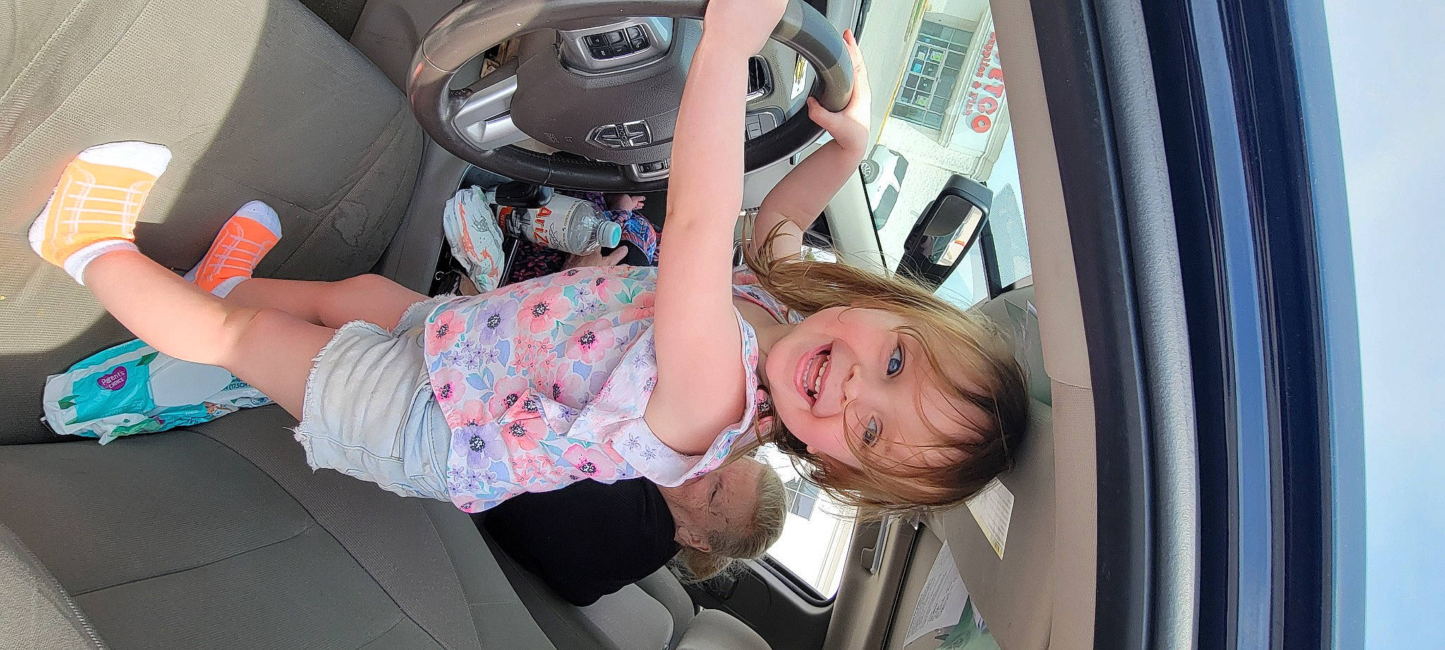 Caroline joined the competition — help win amazing prizes! audio_equipment, auto_part, automotive_design, automotive_exterior, automotive_lighting, automotive_tire, bumper, car, child, family_car, fun, human_leg, joy, luxury_vehicle, motor_vehicle, person, personal_luxury_car, steering_wheel, thigh, toddler