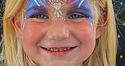 Lakelynn is registered to the contest to win money with this photo: child, girl, face_paint, blonde_hair, smile, blue_eyes, portrait, colorful, glitter, face_art, happy, summer, outdoor, person, closeup, youth, festival, costume, fun, painted_face