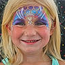 child, girl, face_paint, blonde_hair, smile, blue_eyes, portrait, colorful, glitter, face_art, happy, summer, outdoor, person, closeup, youth, festival, costume, fun, painted_face