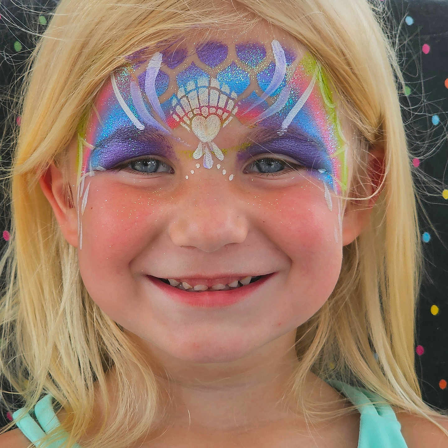 Lakelynn is registered to the contest to win money with this photo: child, girl, face_paint, blonde_hair, smile, blue_eyes, portrait, colorful, glitter, face_art, happy, summer, outdoor, person, closeup, youth, festival, costume, fun, painted_face