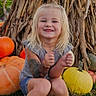 Lakelynn is registered to the contest to win money with this photo: child, girl, smiling, pumpkin, autumn, grass, outdoor, blonde_hair, casual_clothing, crocs, cornstalks, fall, festive, nature, sitting, portrait, happy, seasonal, young_child, celebration