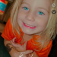 Lakelynn is registered to the contest to win money with this photo: child, smiling, blonde_hair, blue_eyes, orange_shirt, indoor, kitchen, young, happy, portrait, person, face, cute, leaning, casual_clothing, bright, daytime, text_overlay, timestamp, home