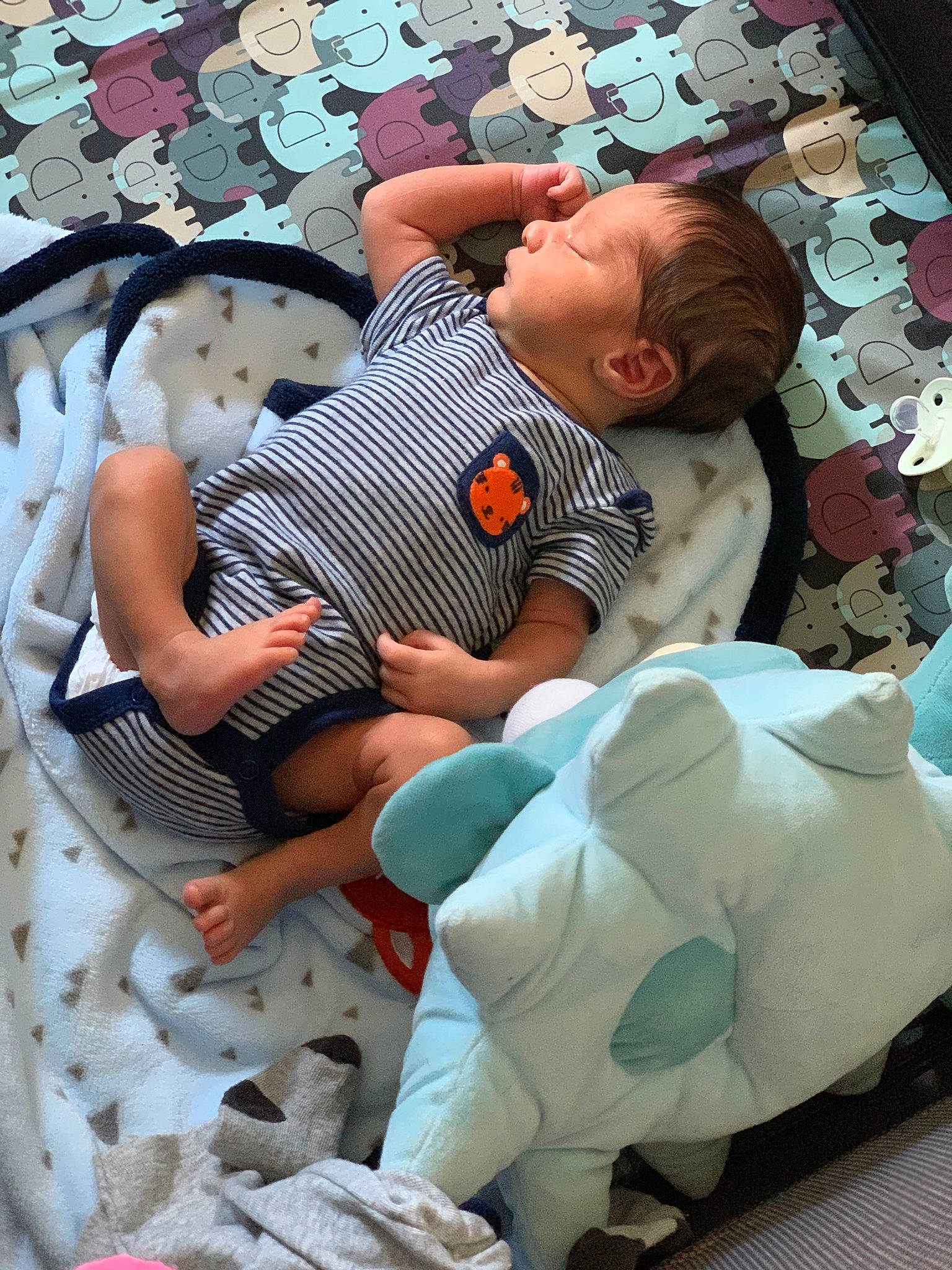 Damian is registered to the contest to win money with this photo: baby, baby_products, baby_toddler_clothing, bedding, child, comfort, event, fun, leisure, linens, nap, pattern, people, person, room, sitting, stuffed_toy, t_shirt, toddler, vacation